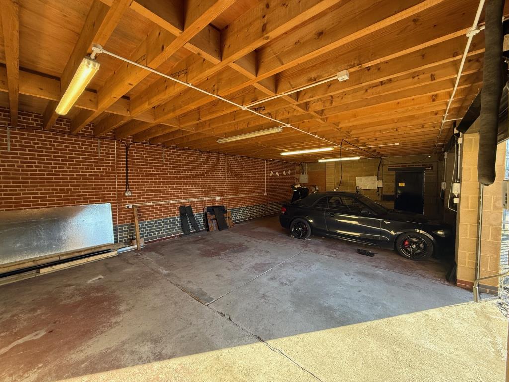Lot: 78 - GARAGES AND FORECOURT WITH POTENTIAL - Inside the garages from front left corner